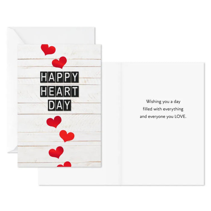 Greeting card with red hearts and 'Happy Heart Day' text on a white background