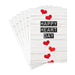 Stack of greeting cards with 'Happy Heart Day' text and red hearts on a white background