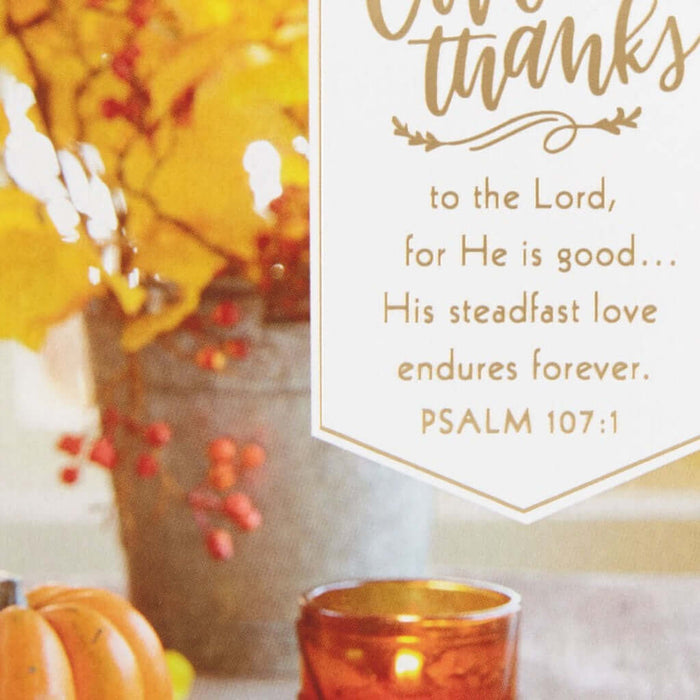 Autumn-themed card with pumpkins, candle, and decorative religious text on a white background