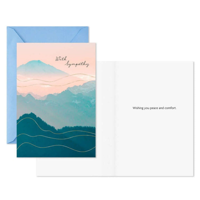 Greeting card with mountain design and blue envelope on white background