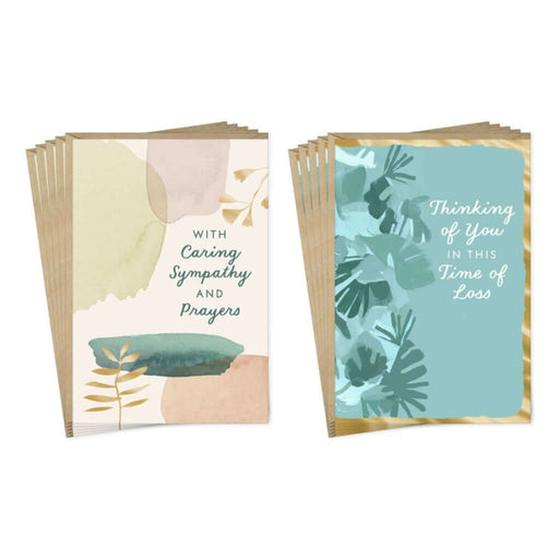 Two sets of sympathy cards with floral designs on a white background
