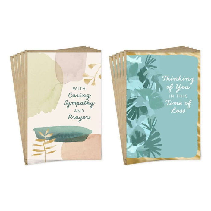 Two sets of sympathy cards with floral designs on a white background