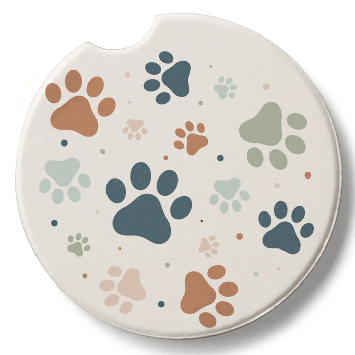 Highland Paw Prints Car Coaster featuring a charming paw print design with an absorbent surface, designed to fit most vehicle cup holders while helping keep them clean and dry.