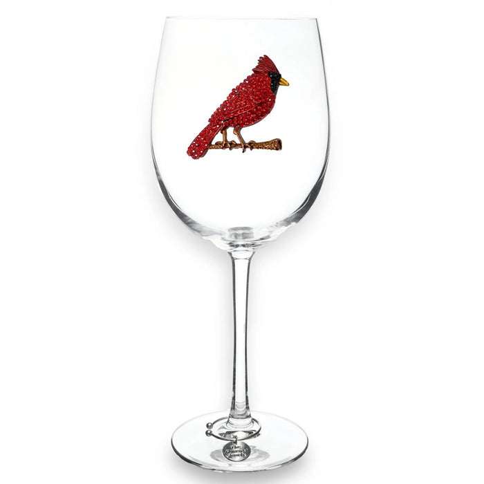 Wine glass with a red cardinal bird design on a white background