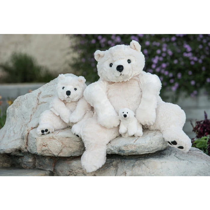 A stuffed polar bear with a gentle face is displayed on a plain white background, emphasizing its cuddly appearance.