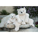 A stuffed polar bear with a gentle face is displayed on a plain white background, emphasizing its cuddly appearance.