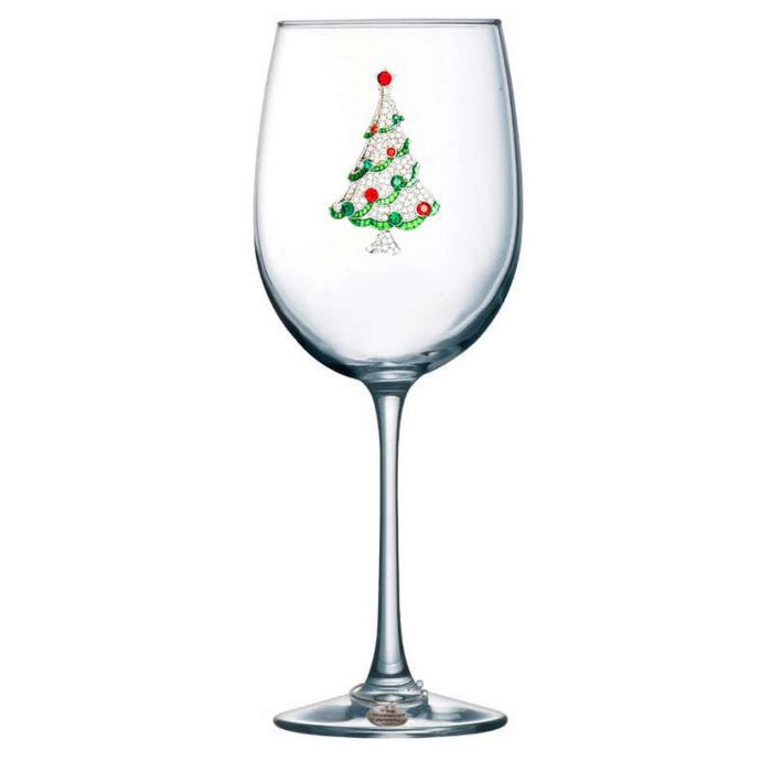 Clear wine glass with a Christmas tree design on a white background