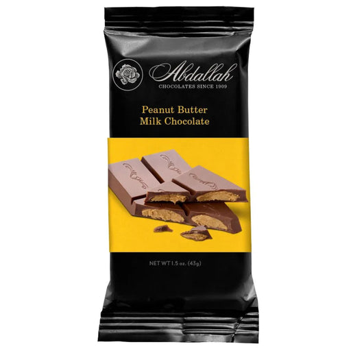 A package of Abdallah Peanut Butter Milk Chocolate bar, featuring a black and yellow wrapper with a photo of chocolate pieces showing the peanut butter filling.