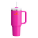 Pink Stanley tumbler with a handle and straw on a white background