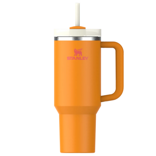Orange Stanley mug with handle and straw on a white background