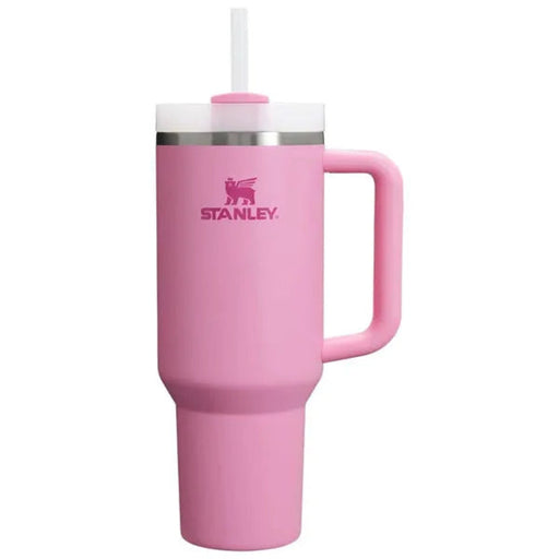 Pink Stanley mug with handle and straw on a white background