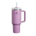 Pink Stanley mug with handle and straw on a white background