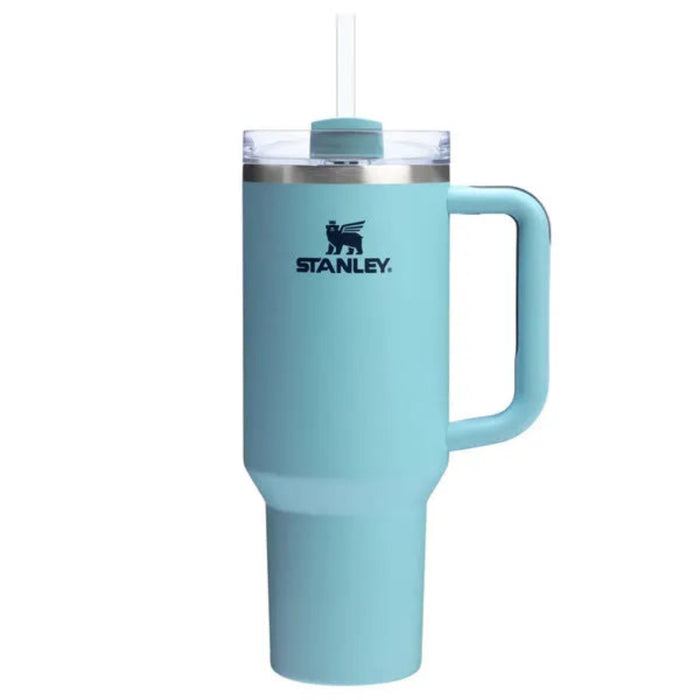 Turquoise Stanley mug with handle on a white background