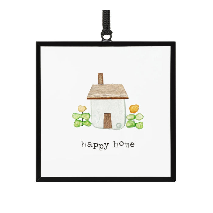 A vibrant framed print depicting a happy home, showcasing warmth and inviting details.