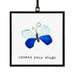 Blue butterfly with open wings resting on a green leaf, showcasing its vibrant colors and delicate patterns.