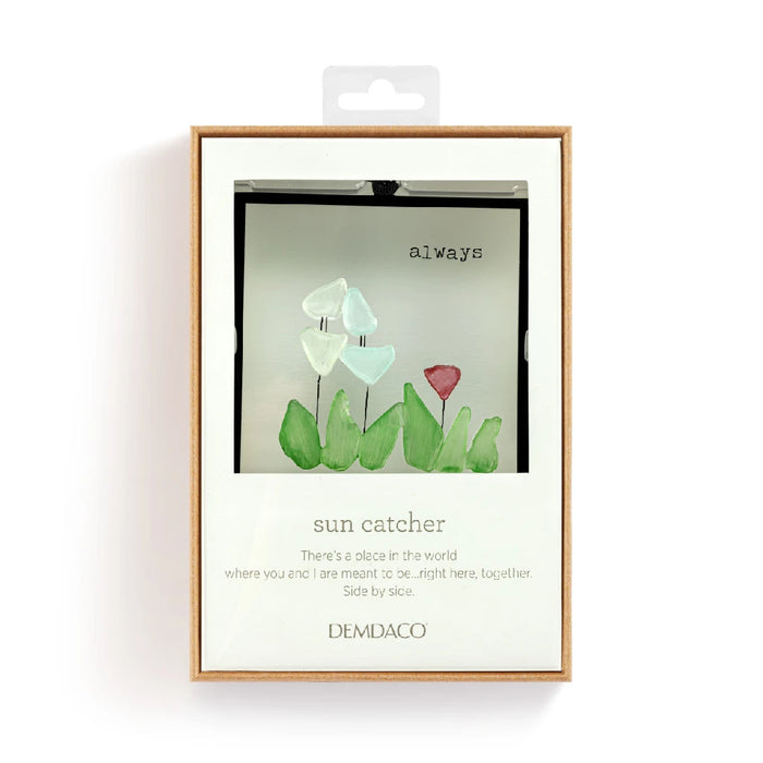 A small card showcasing an image of flowers paired with a sun catcher design.