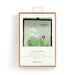 A small card showcasing an image of flowers paired with a sun catcher design.