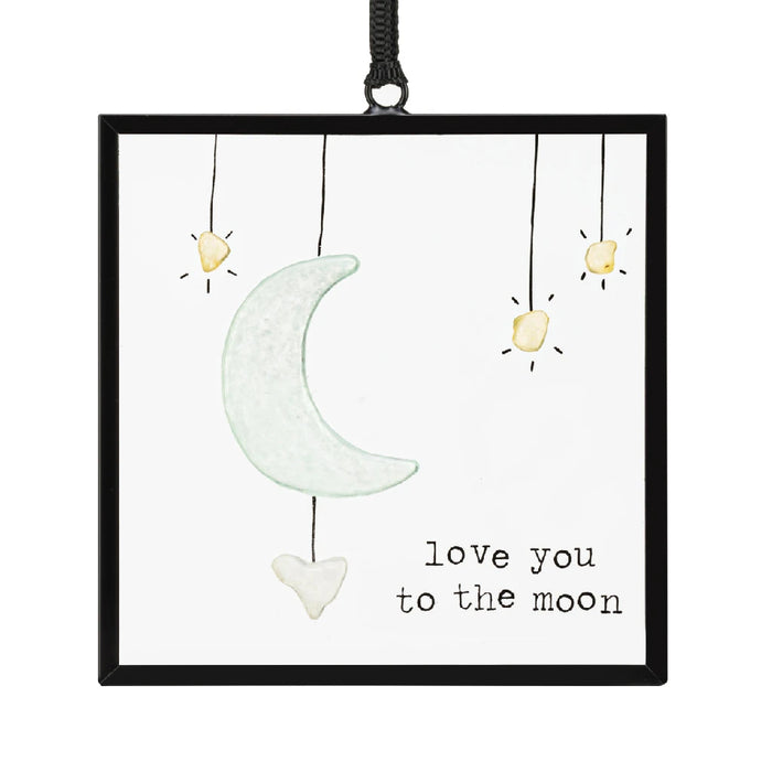 A beautifully crafted ornament inscribed with "I love you to the moon and back," ideal for sentimental gifting.