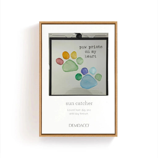 A black frame displaying a dog's paw print, symbolizing pet companionship and love.