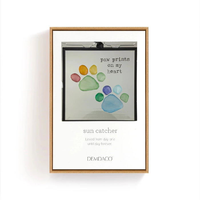 A black frame displaying a dog's paw print, symbolizing pet companionship and love.