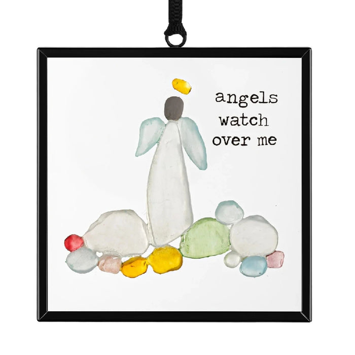 A black-framed ornament with an image of a baby and a balloon, designed for hanging display.