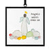 A black-framed ornament with an image of a baby and a balloon, designed for hanging display.