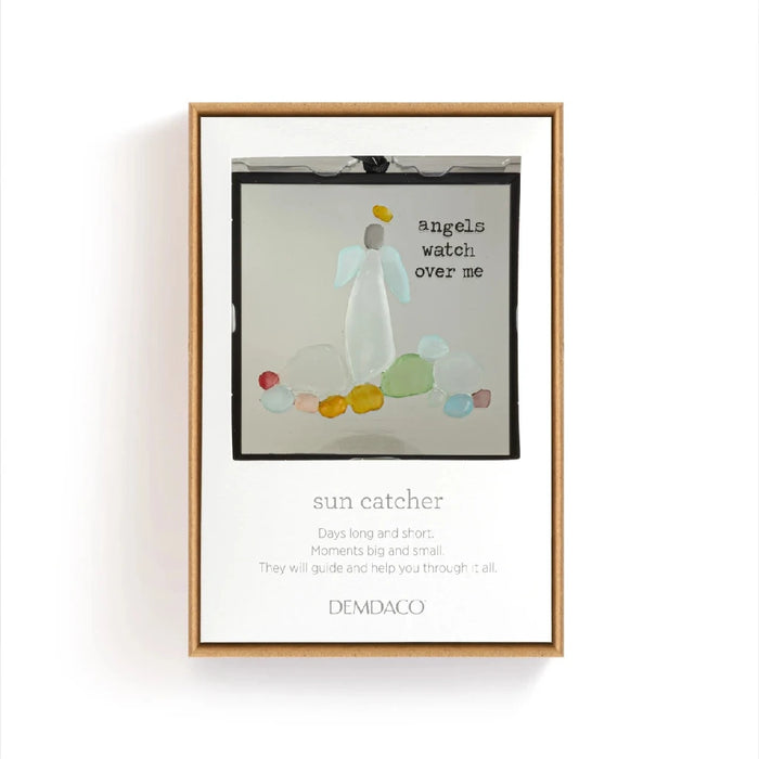 A black-framed hanging ornament showcasing a baby smiling with a balloon in the image.
