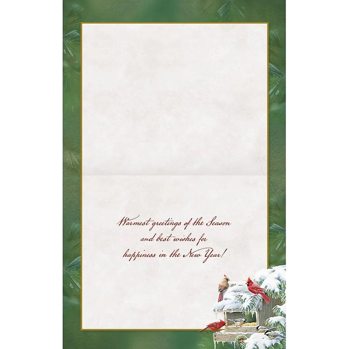 Christmas card with cardinals and snowy scene on a green border