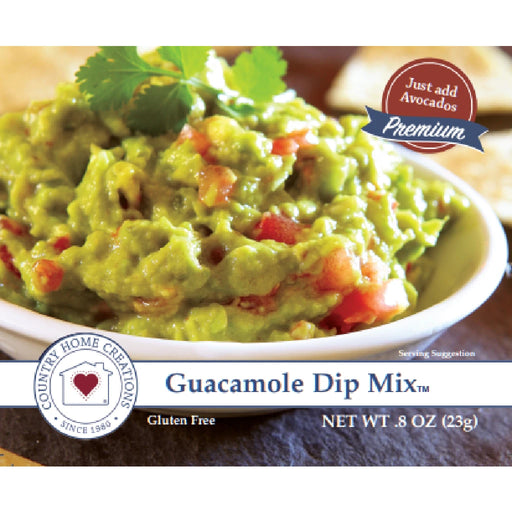 A bowl of creamy guacamole dip mix, garnished with cilantro and served with tortilla chips on the side.