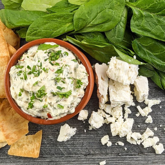 A close-up of feta spinach dip mix, featuring creamy texture and green spinach flecks, ideal for appetizers.