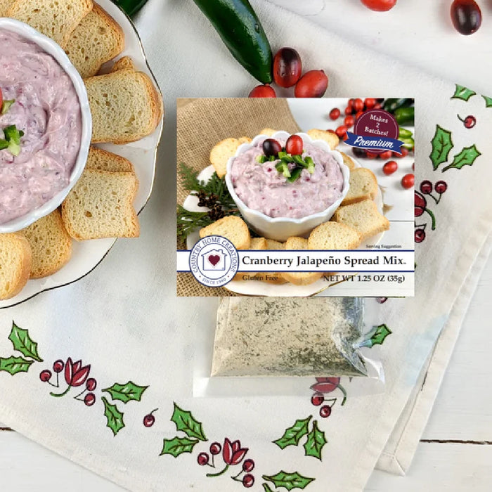 A container of cranberry jalapeño spread mix, highlighting its bright red color and bits of jalapeño throughout.