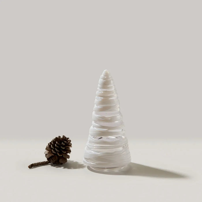 White decorative Snowdrift Conical 8"                Tree is wrapped in delicate, hand-sculpted ribbons of glass on a light background