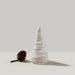 White decorative Snowdrift Conical 8"                Tree is wrapped in delicate, hand-sculpted ribbons of glass on a light background