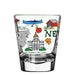 Clear shot glass with New Hampshire-themed illustrations on a white background