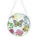 Butterfly Dance decorative glass suncatcher featuring colorful butterflies hanging in a sunny window.