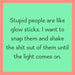 Funny “Drinks On Me: Glow Sticks” drink coaster with playful party-inspired design