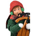 Decorative Byer's Choice  figurine of a boy in winter clothing with a red hat and green scarf, holding a  classic wooden sled.