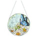 Blue Morpho butterfly stained-glass-style suncatcher with vibrant blue wings hanging in a sunny window.