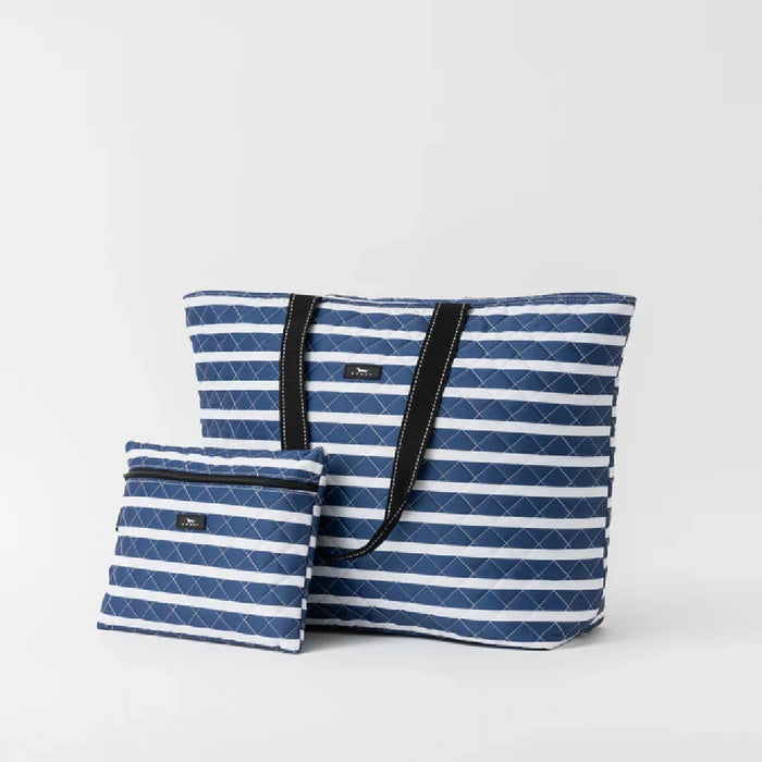 A stylish blue and white striped tote bag with a matching pouch, perfect for carrying essentials.