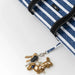A blue and white striped tote bag featuring a coordinating pouch, designed for practicality and style.