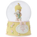 This snow globe, a young girl snuggles her sweet bunny.