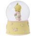 This snow globe, a young girl snuggles her sweet bunny.