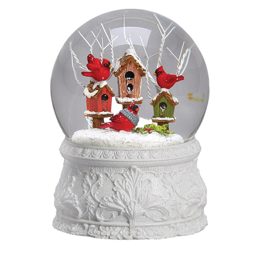 musical glitter dome featuring a red cardinal perched beside decorative birdhouses in a sparkling snowy winter scene.