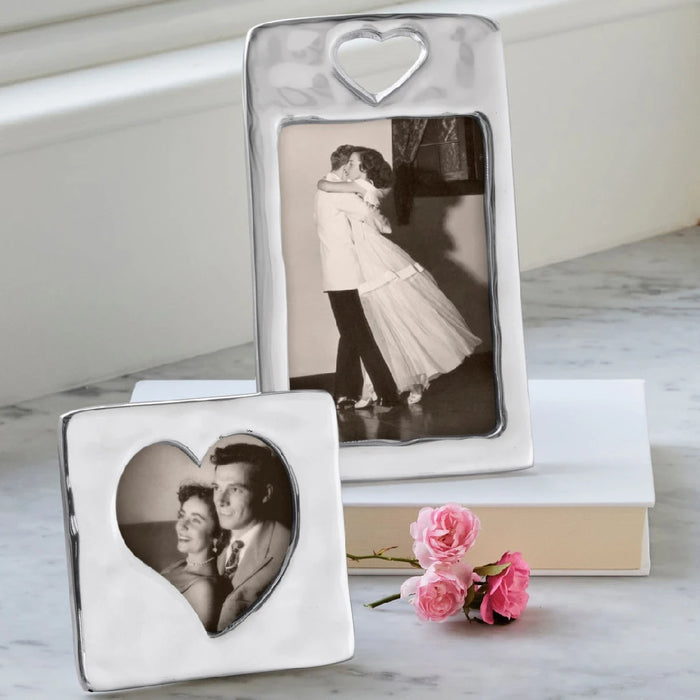 A heart-shaped photo frame, elegantly designed to showcase a special photograph.
