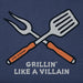 Crossed grill fork and spatula with 'Life is Good' branding, featuring the text 'Grillin' Like a Villain'.