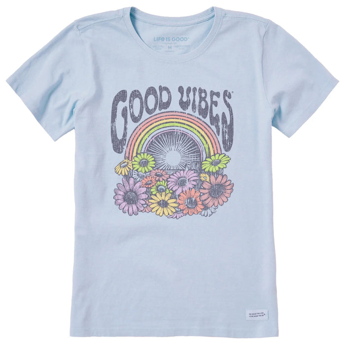 Light blue t-shirt with 'Good Vibes' graphic featuring a rainbow and flowers on a white background.