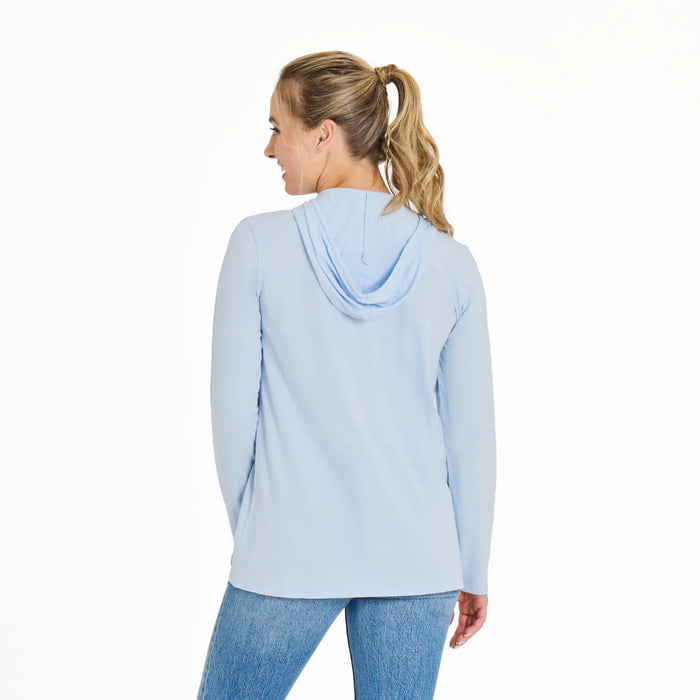Woman wearing a light blue hoodie on a white background