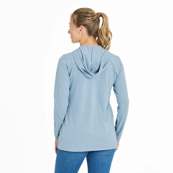 Woman wearing a light blue striped hoodie on a white background