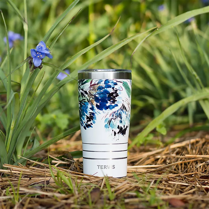 Tervis stainless steel tumbler with Kelly Ventura Protea floral artwork outdoors in garden