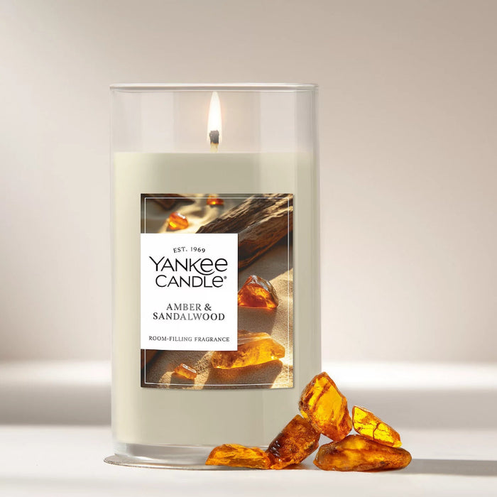 The Yankee Candle Amber &amp; Sandalwood Medium Pillar Candle delivers a deep, warm fragrance that feels both grounding and inviting.
